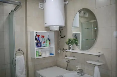 a bathroom with a sink and a mirror at Savinac apartman u srcu Beograda, Trg Slavija in Belgrade