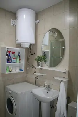 a bathroom with a sink and a mirror at Savinac apartman u srcu Beograda, Trg Slavija in Belgrade