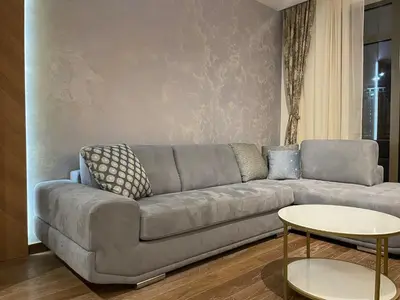 a living room with a couch and a table at Arcadia 22 Belgrade Waterfront in Belgrade