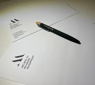 a pen sitting on top of a piece of paper at Arcadia 22 Belgrade Waterfront in Belgrade