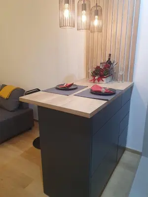 a kitchen with a counter with two plates on it at Downtown in Belgrade