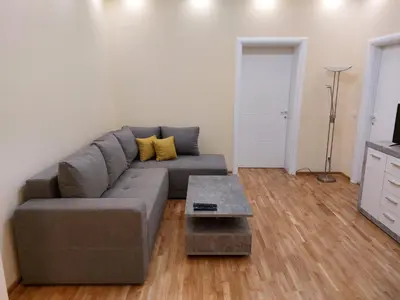 a living room with a couch and a table at Jež in Belgrade