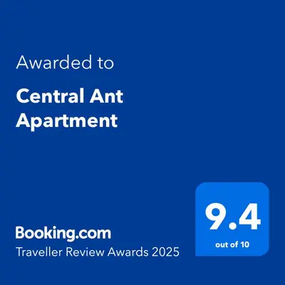 a blue sign with the text awarded to central art experiment at Central Ant Apartment in Belgrade