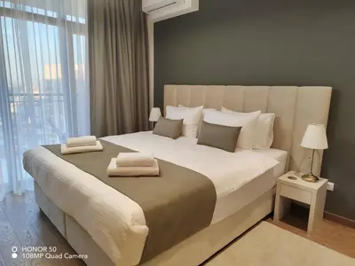 a bedroom with a large bed with a large window at BW Sky View, 23rd Floor, Belgrade Waterfront in Belgrade