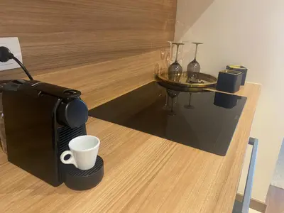 a coffee maker and a cup on a counter at BW Sky View, 23rd Floor, Belgrade Waterfront in Belgrade