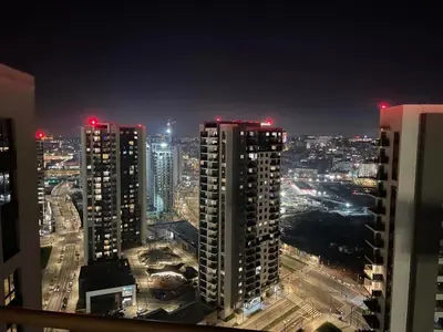 a city skyline at night with tall buildings at BW Sky View, 23rd Floor, Belgrade Waterfront in Belgrade