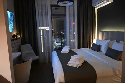 a hotel room with a large bed and a window at BW Sky View, 23rd Floor, Belgrade Waterfront in Belgrade