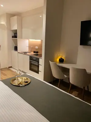 a kitchen and dining room with a table and chairs at BW Sky View, 23rd Floor, Belgrade Waterfront in Belgrade