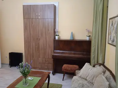 a living room with a piano and a couch at Bajloni lux in Belgrade