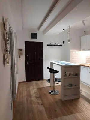 a kitchen with a counter and a stool in a room at Room 23 in Belgrade