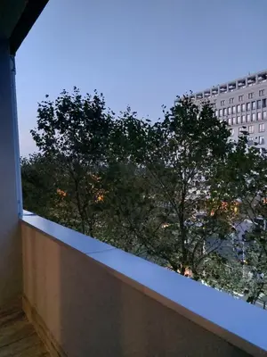 a view from the balcony of a building with trees at Boulevards apartment in Belgrade