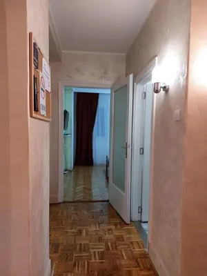 a hallway with a hallway leading to a room at Boulevards apartment in Belgrade