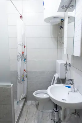 a bathroom with a toilet and a sink at Boulevards apartment in Belgrade