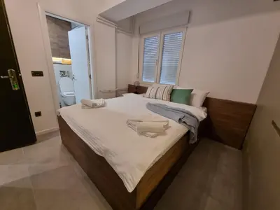 a bedroom with a large bed in a room at Parliament View Apartments in Belgrade