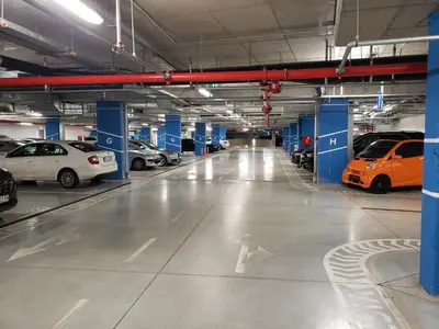 a parking garage with cars parked in it at B-G Waterfront Apartment in Belgrade