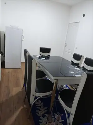 a conference room with a table and chairs at Apartmani Mladenović in Kijevo