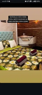 a bedroom with a bed with two suitcases on it at President app Arandjelovac in Arandjelovac