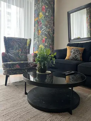 a living room with a couch and a table at Belgrade Waterfront Escape 104 in Belgrade