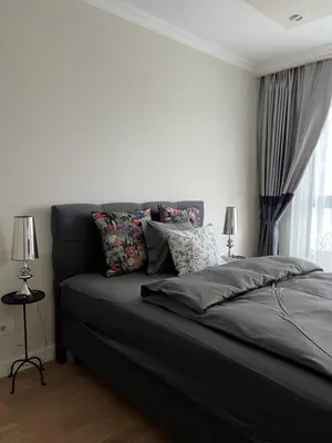 a bedroom with a black bed with pillows and a window at Belgrade Waterfront Escape 104 in Belgrade