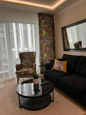 a living room with a couch and a coffee table at Belgrade Waterfront Escape 104 in Belgrade