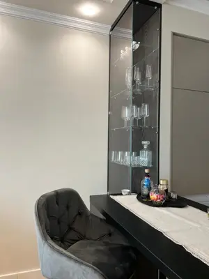 a black chair sitting next to a counter in a room at Belgrade Waterfront Escape 104 in Belgrade