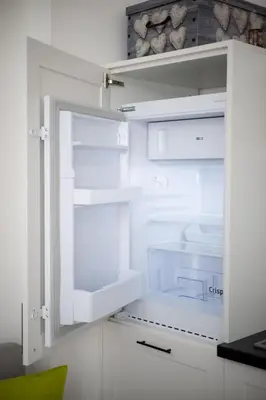 an empty refrigerator with its door open in a kitchen at You will love it, in Vracar in Belgrade
