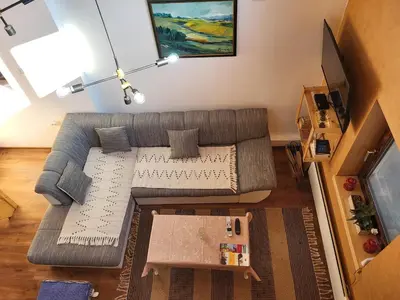 a living room with a couch and a table at Vila Mila Fruška Gora in Velika Remeta