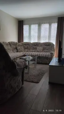 a living room with a couch and a table at Centar_park in Arandjelovac