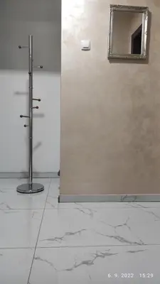 a bathroom with a shower and a mirror on the wall at Centar_park in Arandjelovac