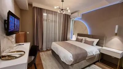 a hotel room with a large bed and a tv at Belgrade Waterfront-Beograd na vodi - BW Arcadia Lux in Belgrade