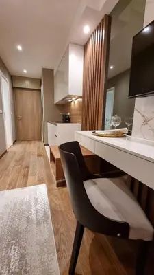 a kitchen with a desk and a chair in a room at Belgrade Waterfront-Beograd na vodi - BW Arcadia Lux in Belgrade