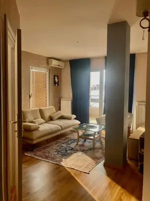 a living room with a couch and a table at MiniCity Inn in Belgrade