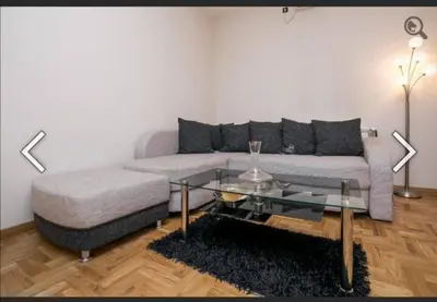 a living room with a couch and a coffee table at Višegradska in Sajmište