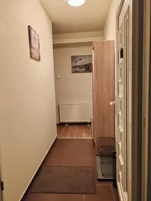 a hallway with a door leading into a room at Cozy green house (free parking spot) in Belgrade