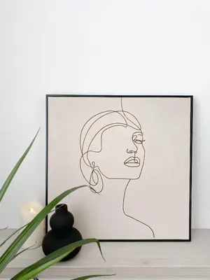 a drawing of a woman with earrings at Lolita Lux - Belgrade Waterfront in Belgrade