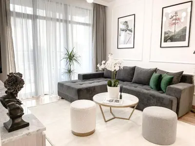 a living room with a couch and a table at Lolita Lux - Belgrade Waterfront in Belgrade