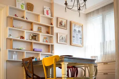 a dining room with a table and chairs at Sava Centar 1-bedroom apartments in the heart of New Belgrade in Belgrade
