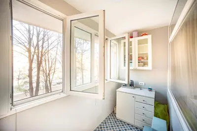 a bathroom with two windows and a sink at Sava Centar 1-bedroom apartments in the heart of New Belgrade in Belgrade