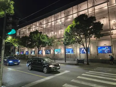 a car parked in front of a building at night at Angelina 2 in Belgrade