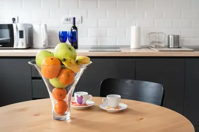 a vase filled with fruit sitting on a table at Apartment Vracar Belgrade, St Sava Church Park in Belgrade
