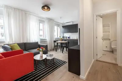 a living room with a couch and a table at Apartment Vracar Belgrade, St Sava Church Park in Belgrade