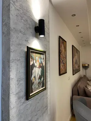 a living room with a painting on the wall at Garden House Lux in Belgrade