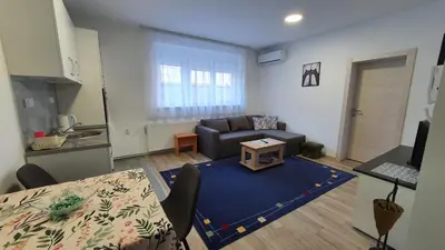 a living room with a couch and a table at IMPERIUM stan na dan in Inđija