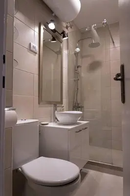a bathroom with a toilet and a sink and a shower at Classico apartment Belgrade in Voždovac
