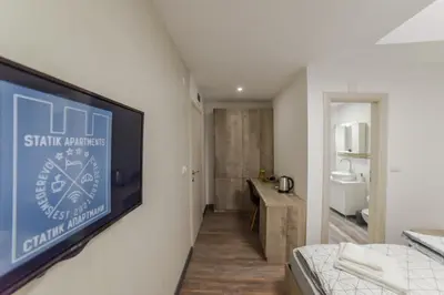 a room with a wall mounted clock on a wall at Apartmani Statik SD in Smederevo
