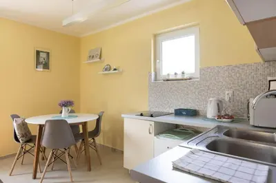 a kitchen with a sink and a table at Charlie&Blueberries in Belgrade