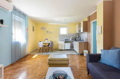 a living room with a couch and a table at Charlie&Blueberries in Belgrade