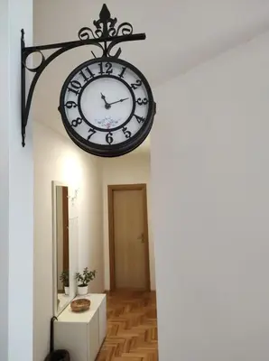 a clock hanging from a wall in a room at Stari Cerak in Žarkovo