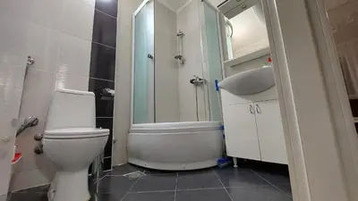 a bathroom with a toilet and a sink and a shower at Apartman 23 in Belgrade