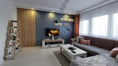 a living room with a couch and a tv at Apartman 23 in Belgrade